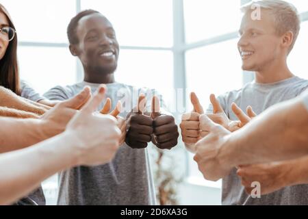 close up. group of like-minded showing thumbs up. Stock Photo