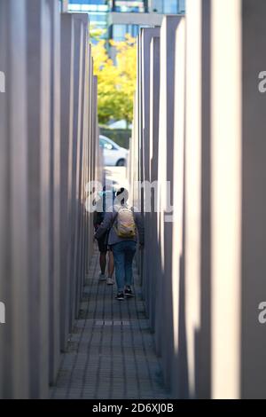 Visitors at the Holocaust Memorial in the centre of Berlin