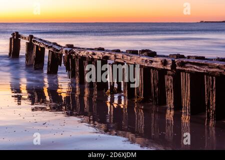 The iconic erosion groynes at sunrise in Victor Harbor South Australia ...