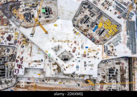 big construction site with working construction cranes. top view of foundation and construction equipment Stock Photo