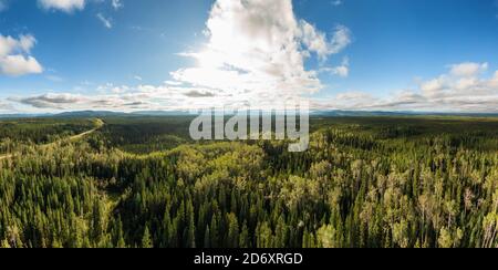 Picturesque Panoramic View of Forest from Above alongside Scenic Road Stock Photo