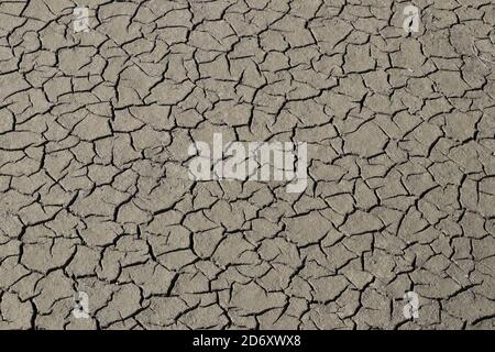 Natural cracks in the mud of a river Stock Photo