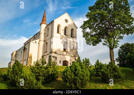 A Small Church in the Middle of the lush Green Spring Landscape on a Sunny Day. Church in Lithuanua Stock Photo