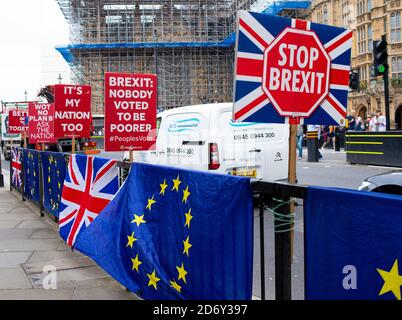 Anti-Brexit campaign posters being used by protesters outside the Houses of Parliament, London, in protest of the UK leaving the European Union.. Stock Photo