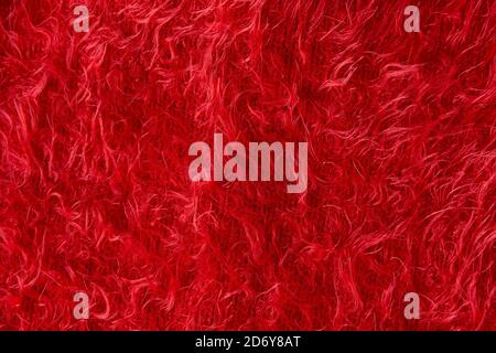 red fluffy cloth texture. Close up of plush burgundy sweater. Chirstmas background  Stock Photo