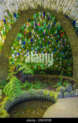 Colored bottle's and fern, Westonbury Mill Water Gardens, Herefordshire UK. September 2020. Stock Photo