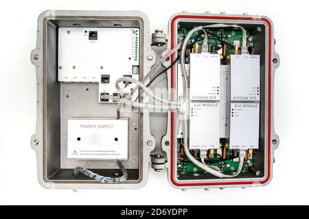 CATV system hanging on black optical fiber cables for amplify TV signals installed with coaxial cables Stock Photo