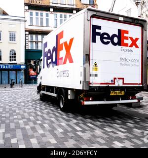 London UK October 19 2020, A FedEx Delivery Vehicle Or Van Deliving Goods To High Street Shops With No People Stock Photo