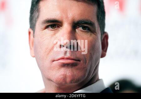 Simon Cowell pictured in the press room at the National Television Awards, at the O2 centre in east London. Stock Photo