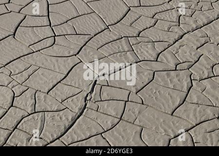 Natural cracks in the mud of a river Stock Photo