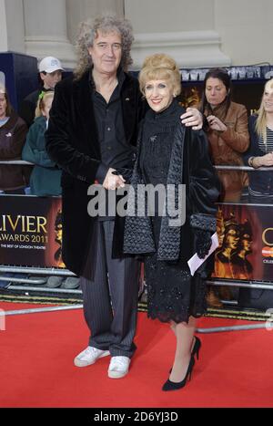 Brian May and Anita Dobson arrive at the 2011 Laurence Olivier Awards at the Theatre Royal in London Stock Photo