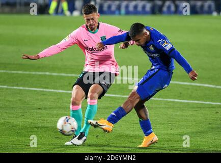 lement Lenglet of FC Barcelona and Cucho Hernandez of Getafe CF in action during the Spanish championship La Liga football match between Getafe CF an Stock Photo