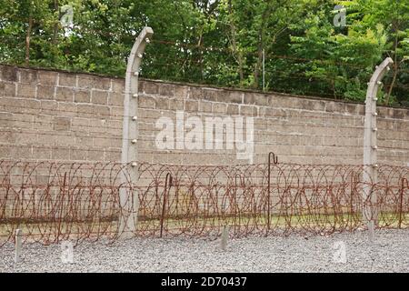 Sachsenhausen, Oranienburg, Germany - July 13, 2017: Barbed wire at Sachsenhausen concentration camp memorial site. Over 200,000 prisoners were impris Stock Photo