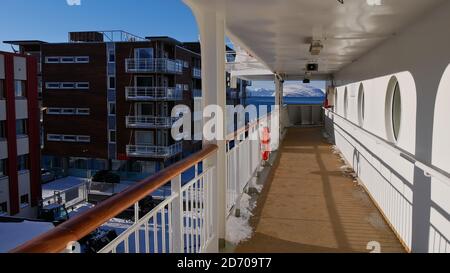 Hammerfest, Norway - 03/02/2019: Gangway of Hurtigruten cruise ship MS Trollfjord lying at anchor in the harbor of Hammerfest. Stock Photo