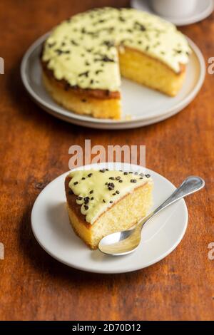 Piece of lemon cake on dessert plate. Stock Photo