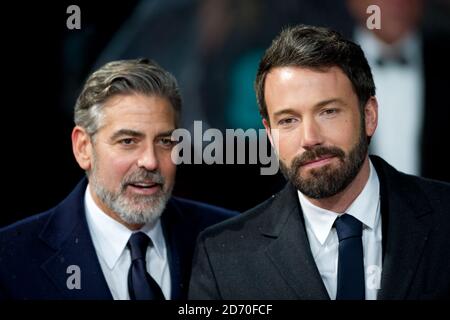 George Clooney and Ben Affleck (right) attending the Bafta Awards, at the Royal Opera House in central London. Stock Photo