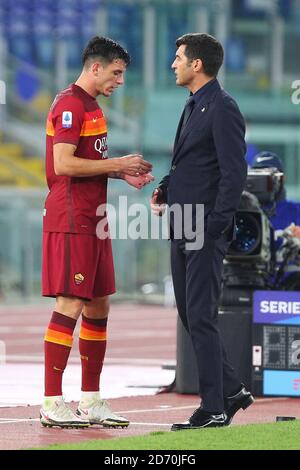 oger Ibanez of Roma (L) and Roma head coach Paulo Fonseca talk each other during the Italian championship Serie A football match between AS Roma and Stock Photo