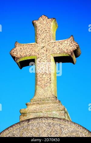 Granite stone religious grave cross the symbol of the Crucifixion of Jesus Christ Stock Photo