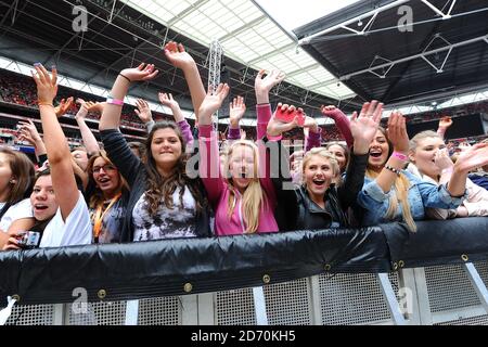 Fans during Capital FM's Summertime Ball at Wembley Stadium, London. Stock Photo