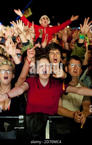 The crowd watch The Stone Roses performing at the Isle of Wight ...