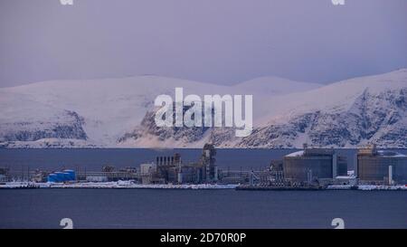 Hammerfest, Norway - 03/01/2019: Europe's largest liquefied natural gas (LNG) site on Melkøya island in the arctic sea with snow-covered mountains. Stock Photo