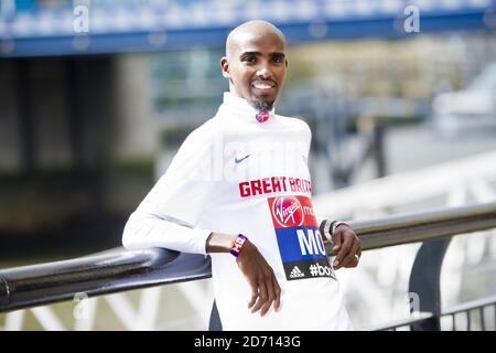 Mo Farah poses during a photocall promoting the VIrgin London Marathon, at Tower Bridge, London. Stock Photo