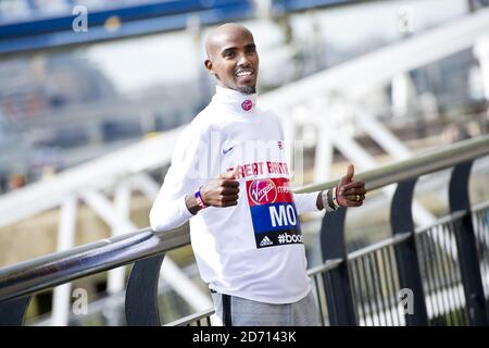 Mo Farah poses during a photocall promoting the VIrgin London Marathon, at Tower Bridge, London. Stock Photo