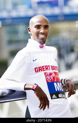 Mo Farah poses during a photocall promoting the VIrgin London Marathon, at Tower Bridge, London. Stock Photo