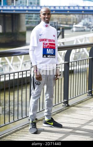 Mo Farah poses during a photocall promoting the VIrgin London Marathon, at Tower Bridge, London. Stock Photo