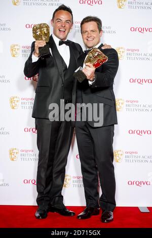 Anthony McPartlin and Declan Donnelly (right) with the Entertainment Programme Award for Saturday Night Takeaway, at the 2014 Arqiva British Academy Television Awards at the Theatre Royal, Drury Lane, London. Stock Photo