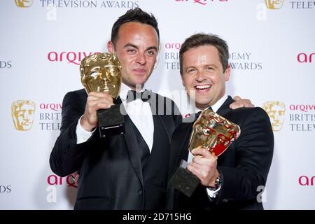 Anthony McPartlin and Declan Donnelly (right) with the Entertainment Programme Award for Saturday Night Takeaway, at the 2014 Arqiva British Academy Television Awards at the Theatre Royal, Drury Lane, London. Stock Photo