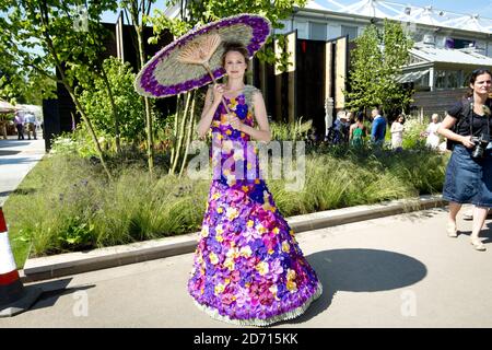 A model wears a dress designed by M&G, made from Orchida 'Vanda' heads, at the 2014 RHS Chelsea Flower Show in west London. Stock Photo