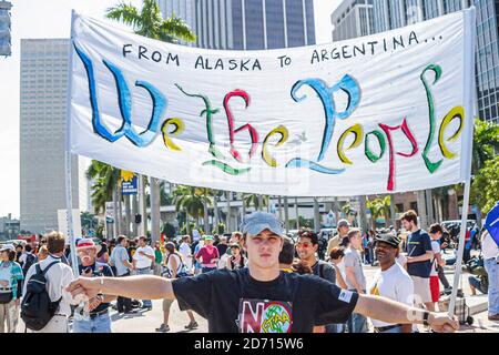 Miami Florida,Biscayne Boulevard,Free Trade Area of Americans Summit FTAA demonstrations,protester holding banner we the people, Stock Photo