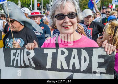 Miami Florida,Biscayne Boulevard,Free Trade Area of Americans Summit FTAA demonstrations,protester woman female senior holds holding sign poster, Stock Photo