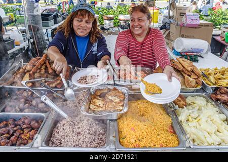 Miami Florida,Little Havana,Hispanic Calle Ocho,Tres Reyes Magos Three 3 Kings parade,street food vendor seller stall booth rice beans chicken paella, Stock Photo