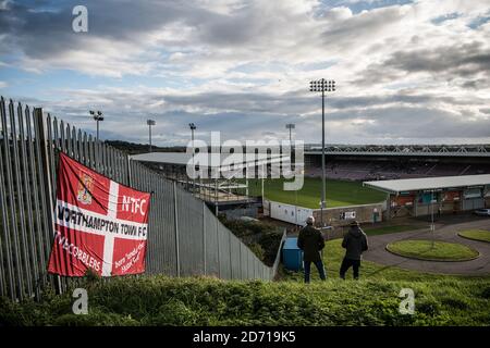 Northampton Town 0 Peterborough United 2, 10/09/2020. Sixfields Stadium, League One. Fans gather on the hill outside the stadium to watch the action. Stock Photo