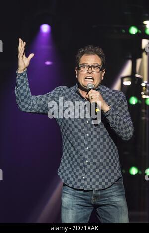 Alan Carr performing at the Teenage Cancer Trust comedy night, at the Royal Albert Hall in London. Stock Photo