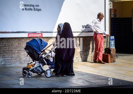 Muslim women along the Uxbridge Road in Shepherd's Bush, west London. September 30th will mark 100 days since the UK voted to leave the EU, during which time reported anti-immigrant and islamophobic hate crimes have increased. Stock Photo