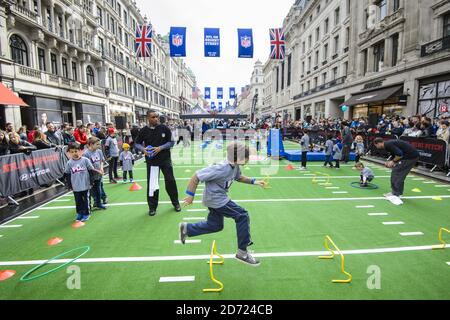 New Orleans Saints fans on Regents Street in London, ahead of a celebration  of American football Stock Photo - Alamy