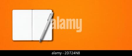 Orange open lined notebook mockup with a pen isolated on colorful background. Horizontal banner Stock Photo