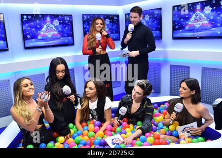 Little Mix are interviewed by the Capital Breakfast presenters backstage during Capital's Jingle Bell Ball with Coca-Cola at London's O2 arena. Picture date: Saturday December 3rd, 2016. Photo credit should read: Matt Crossick/ EMPICS Entertainment. Stock Photo