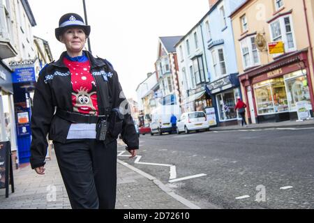 PCSO Officer Sian Clarke adds a Christmas jumper to her uniform, as Cardigan in Wales officially changes its name to Jumper, to support Save the Children's Christmas Jumper Day, taking place this Friday 16th December. Picture date: Wednesday December 14th, 2016. Photo credit should read: Matt Crossick/ EMPICS Entertainment. Stock Photo