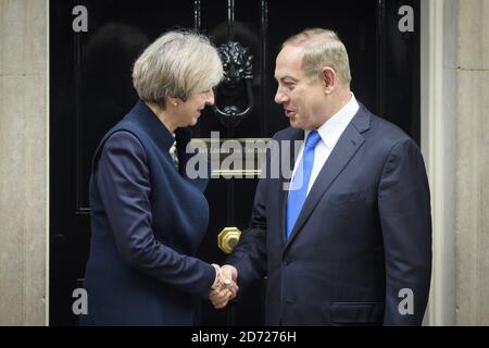 Prime Minister Theresa May greets Israeli Prime Minister Benjamin Netanyahu as he arrives in Downing Street, London, to discuss bilateral relations between the UK and Israel including the potential for more trade post-Brexit.Picture date: Monday February 6th, 2017. Photo credit should read: Matt Crossick/ EMPICS Entertainment. Stock Photo