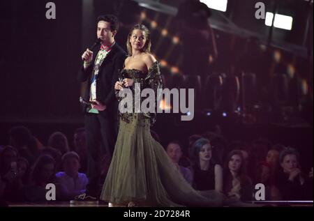 Nick Grimshaw and Rita Ora on stage at the BRIT Awards 2017, held at The O2 Arena, in London.  Picture date Tuesday February 22, 2017. Picture credit should read Matt Crossick/ EMPICS Entertainment. Editorial Use Only - No Merchandise. Stock Photo