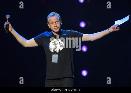 Tim Lovejoy performing on stage at the Royal Albert Hall in London for