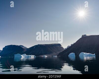 Icebergs in the  Uummannaq fjord system in the north of west greenland. Nuussuaq Peninsula in the background. America, North America, Greenland, Denma Stock Photo