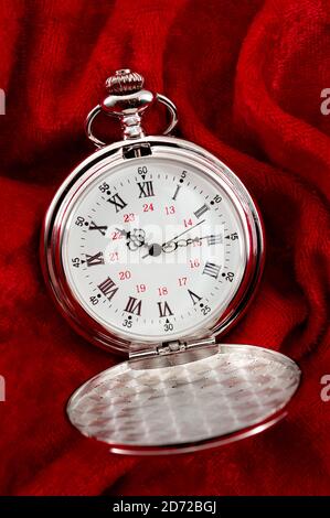 Countdown deadline, precision instrument and nostalgic jewelry open lid retro silver pocket watch with minutes, hours and seconds hands isolated on re Stock Photo
