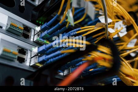Close up view of internet equipment and cables in the server room Stock Photo