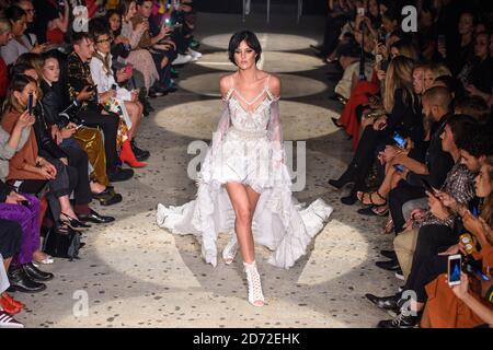 Eliza Cummings on the catwalk during the Julien Macdonald London Fashion Week SS18 show, held at