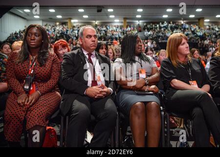 Delegates including new London Labour MPs (l-r) Bambos Charalambous, Marsha de Cordova and Sarah Jones listen as Mayor of London Sadiq Khan speaks during the Labour Party conference in Brighton. Picture date: Monday September 25th, 2017. Photo credit should read: Matt Crossick/ EMPICS Entertainment. Stock Photo